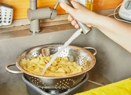 Side-by-side comparison of frozen fresh pasta: perfectly cooked al dente pasta with herbs and Parmesan versus overcooked mushy pasta, highlighting proper cooking techniques.