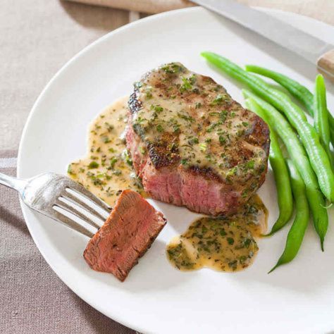 Different cooking methods for petite tender beef filet including pan-searing, grilling, and oven roasting, highlighting techniques to achieve a tender and flavorful steak.