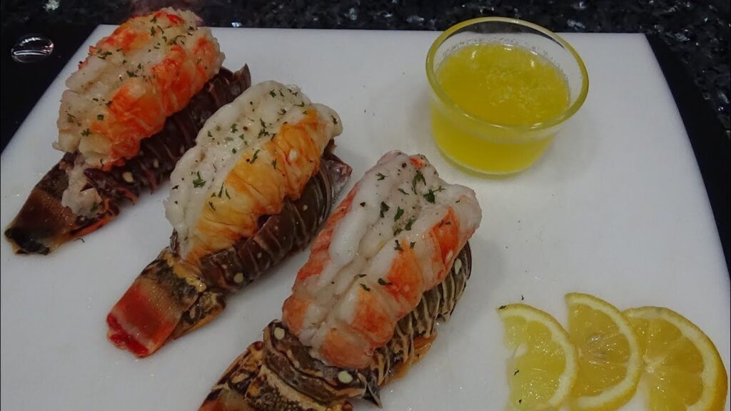 Sous-vide method for re-heating cooked lobsters how to, gently warming lobster meat in a water bath for perfect tenderness.
